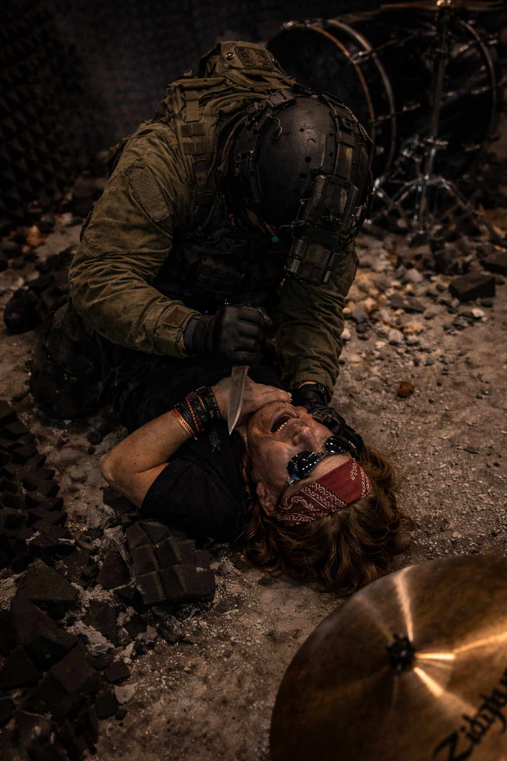 The studio in chaos &mdash; cymbal stand swung, drum hardware scattered, the stream still live to ten million